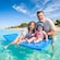 A man posing in the water with his 2 young daughters at Kuza Beach Park